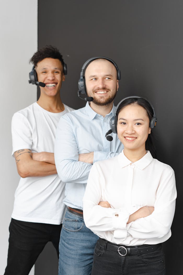 Smiling customer service team showcasing diversity and teamwork with headsets.